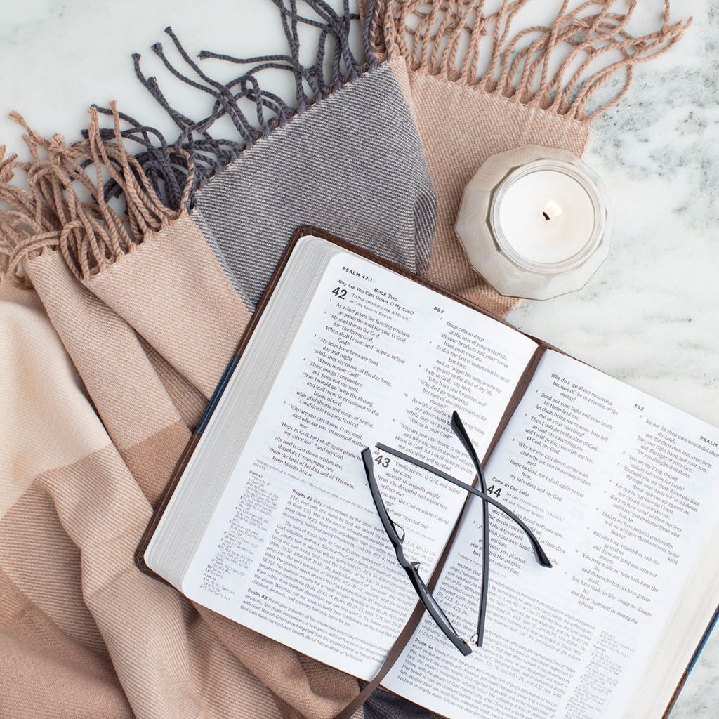 bible-with-glasses-on-blanket